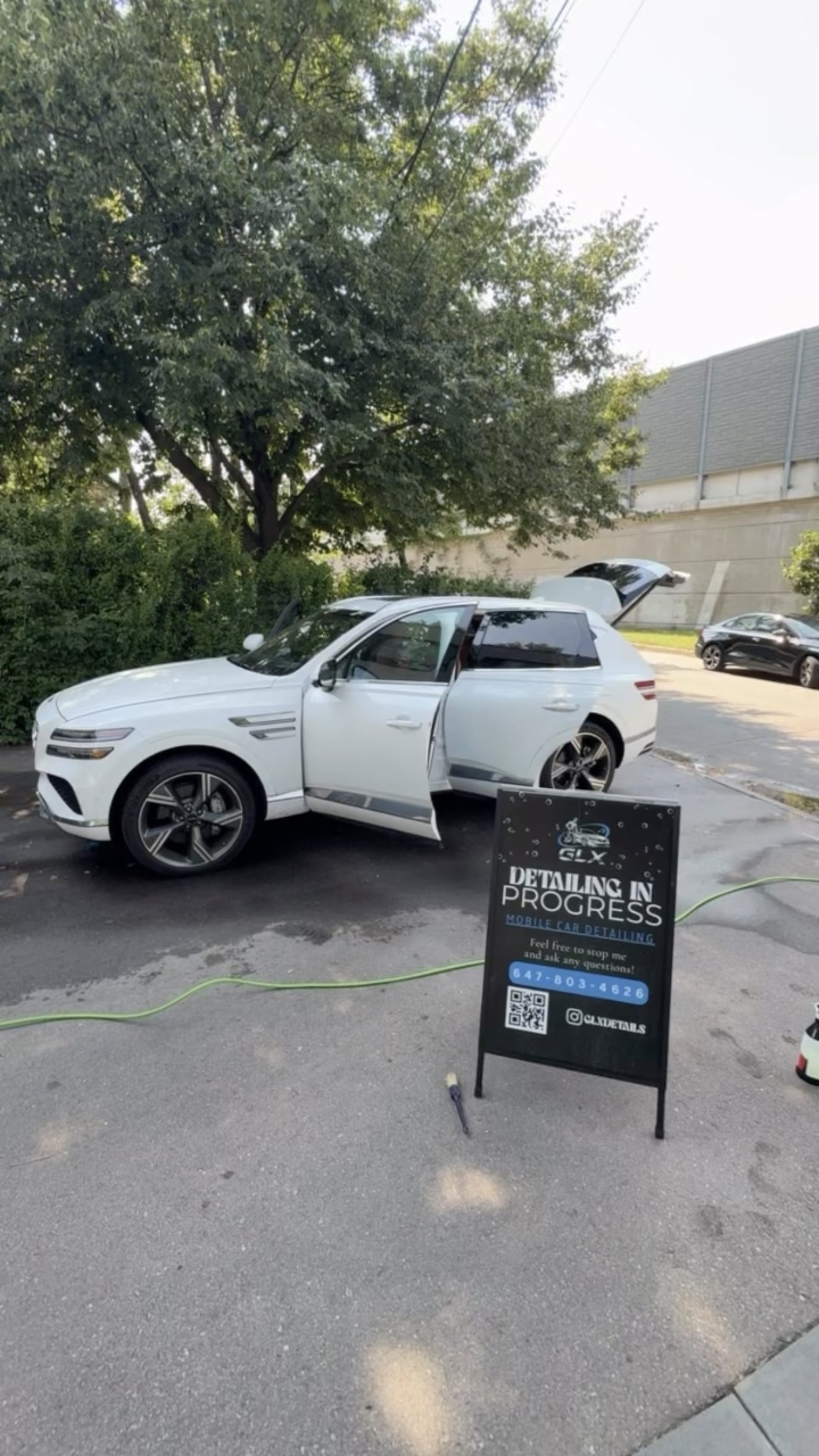 Mobile detailing in progress with Genesis SUV